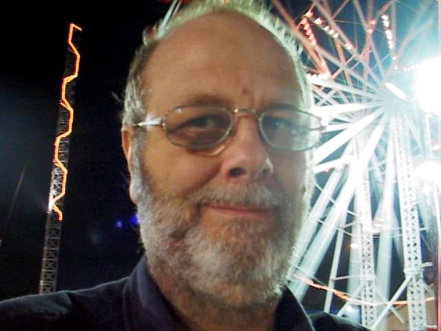 regular self portrait with ferris wheel in the background